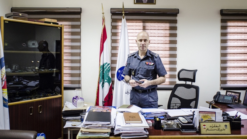 Joseph Mousallem, ISF spokesman, acknowledges that victims of sex trafficking are frequently treated as criminals by the justice system. He is shown here in his office in Beirut He