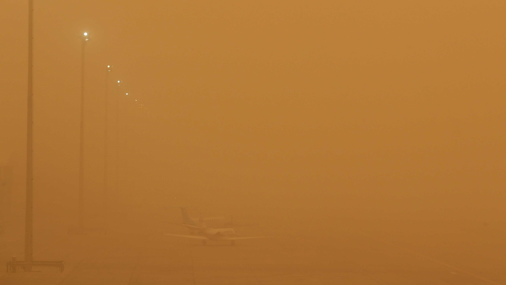 The Calima wind, carrying sand from the Sahara, closed the Canary Islands' airports over the weekend and forced thousands of residents to leave their homes [Borja Suarez/Reuters]