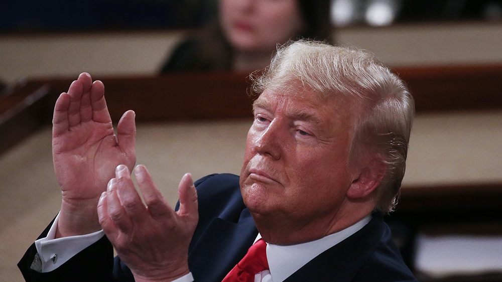 WASHINGTON, DC - FEBRUARY 04: President Donald Trump applauds as he delivers the State of the Union address in the chamber of the U.S. House of Representatives on February 04, 2020 in Washington, DC.