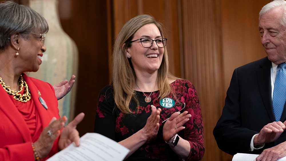 US Representative Jennifer Wexton, centre, applauds after a vote by the Virginia Senate and House of Delegates to ratify the Equal Rights Amendment, during an ERA event at the Capitol in Washington, DC [J Scott Applewhite/AP Photo] [Daylife]