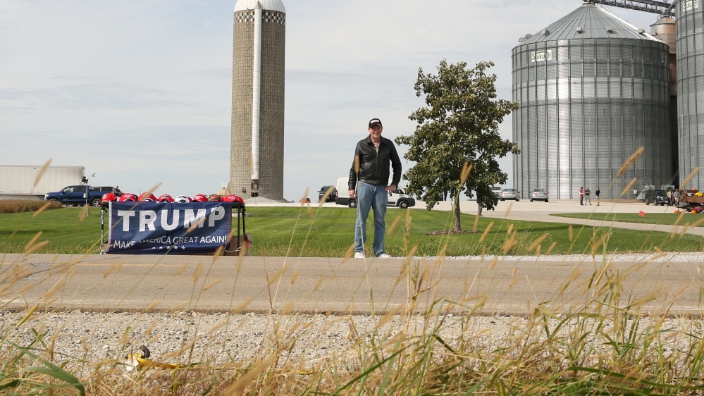 Ronald Solomon of Las Vegas sells hats and clothing supporting Trump at Manning Farms in Waukee, Iowa
