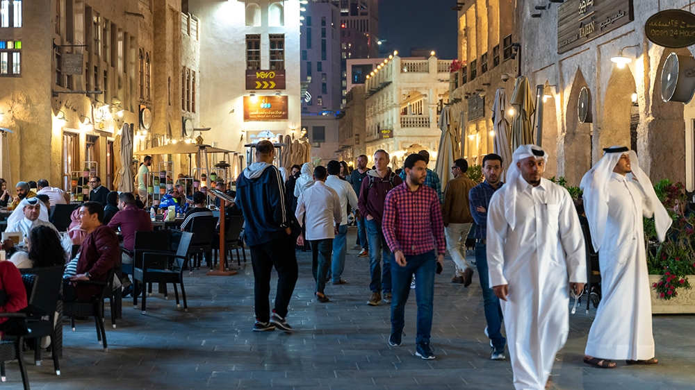 People walk in Souq Waqif, Doha, Qatar on March 06, 2020 [Sorin Furcoi/Al Jazeera]