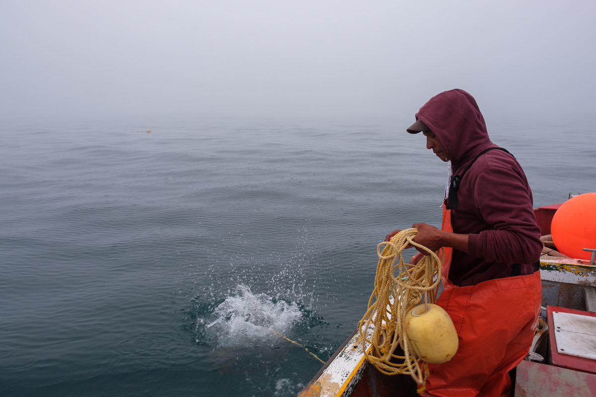 06 December 2019:Christian Adams(left) drops a net while fishing for West Coast Rock Lobster. Christian Adams is a third generation fisher as well as the chairperson of the South African Small-scale F