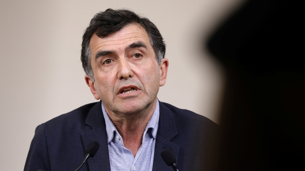 French medical epidemiologist Arnaud Fontanet speaks during a news conference with the prime minister in Paris on the eleventh day of a strict nationwide confinement seeking to halt the spread of COVID-19 disease