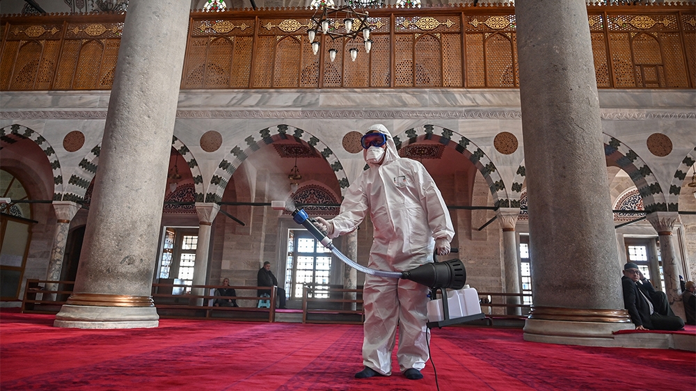 A member of Istanbul''s Municipality disinfects the Mihrimah Sultan Mosque in Istanbul to prevent the spread of the COVID-19, the novel coronavirus, on March 13, 2020. - Turkey said on March 12, 2020 i
