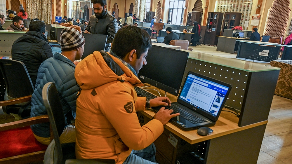 In this photo taken on December 3, 2019, Kashmiri students use the internet at a Tourist Reception Centre (TRC) in Srinagar, as internet facilities have been suspended across the region as part of a p