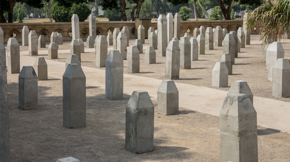 The installation – 444 gravestones, each topped with an eerily wilted metal flower – had been set up in a colonial-era town hall in the heart of Karachi, Frere Hall