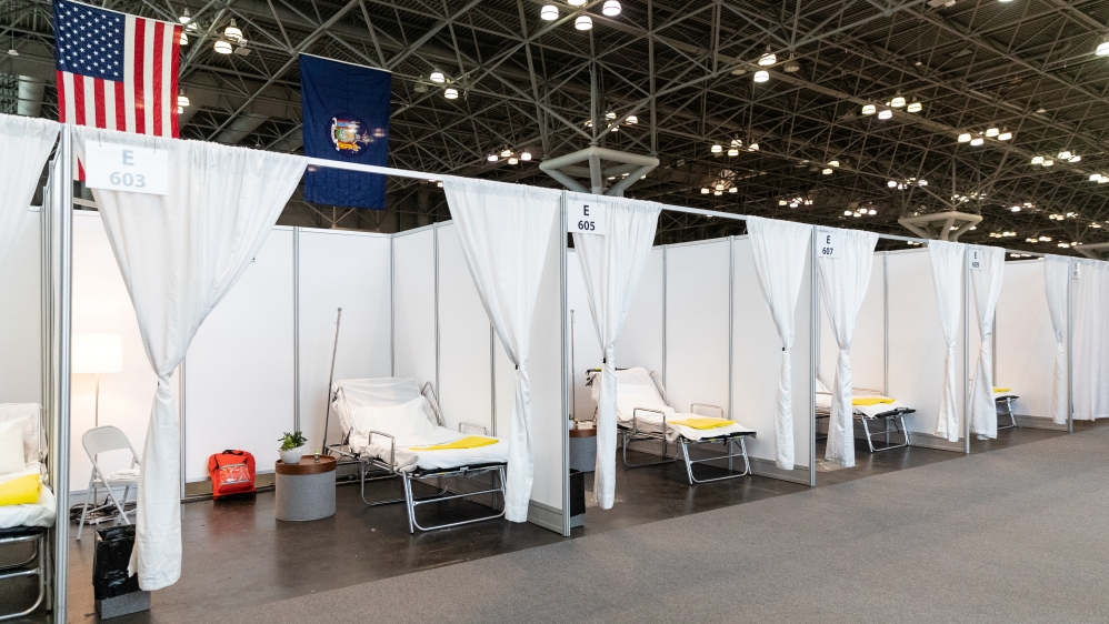 Improvised hospital rooms are seen at a convention centre, which has been partially converted into a hospital, in New York.
