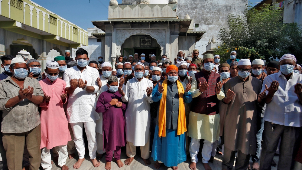 Muslims wearing masks pray for coronavirus patients at a mosque in Ahmedabad, India, on January 31, 2020