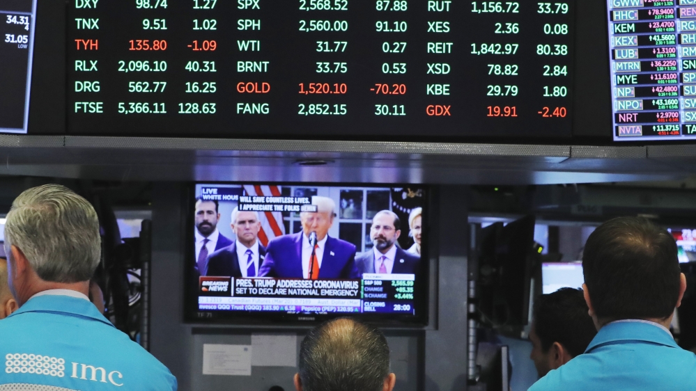 Trump on monitor on the floor of the New Yo