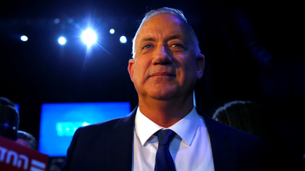 Blue and White party leader Benny Gantz looks on after speaking to supporters following the announcement of exit polls in Israel''s election at the party''s headquarters in Tel Aviv