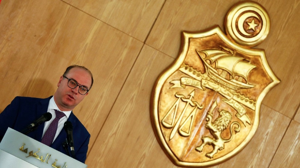 Tunisia's Prime Minister Elyes Fakhfakh speaks next to his predecessor Youssef Chahed (not pictured) during a handover ceremony in Tunis, Tunisia February 28, 2020. REUTERS/Zoubeir Souissi