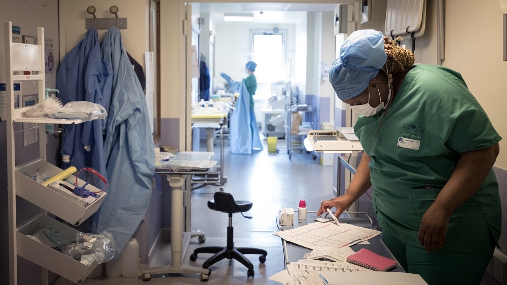A nurse prepares medical equipment at the intensive care unit of the Lariboisiere Hospital in Paris