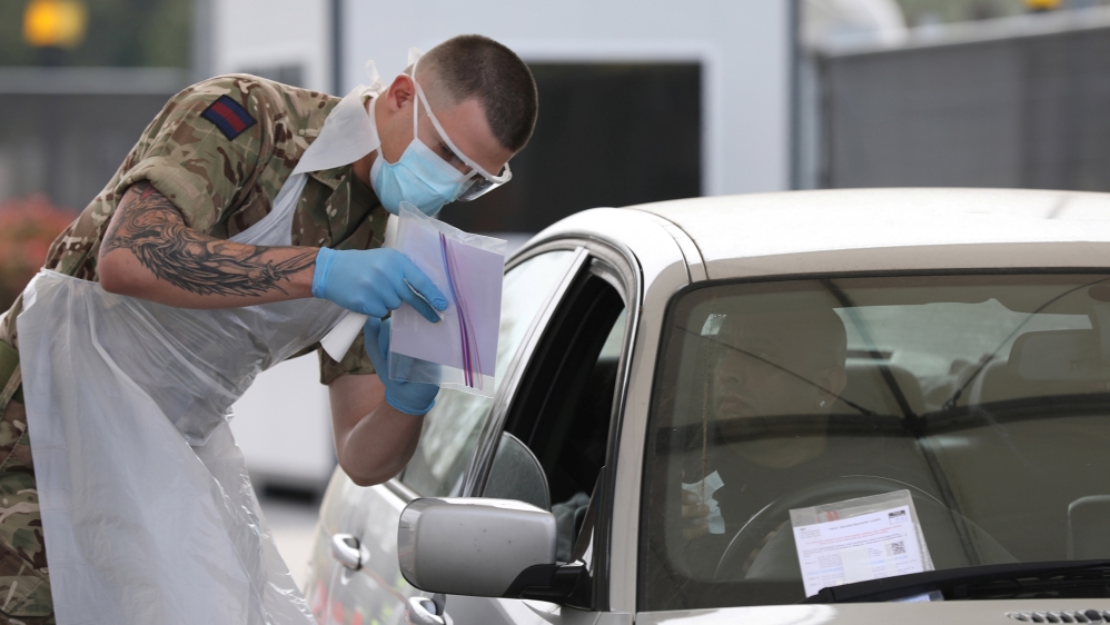 A soldier helps conducting COVID-19 testing for NHS key workers at a testing site in Wembley, London, amid the coronavirus disease (COVID-19) outbreak in Britain, April 16, 2020. UK Ministry Of Defenc