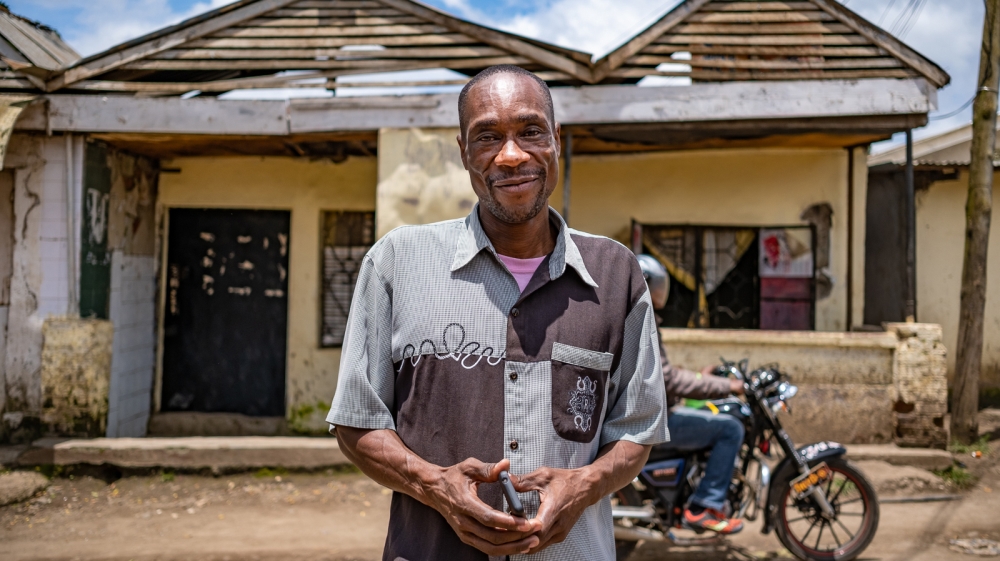 Jeremia Msweta, 50, cannot afford to stay home to avoid getting infected from coronavirus and goes each day to the market in Arusha selling fish