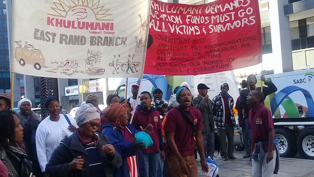 A protest by Kulumani Support Group outside the High Court in Johannesburg during the inquest into Ahmed Timol’s death