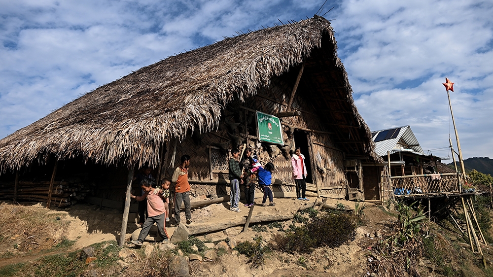 People at a Union Solidarity and Development Party house in Karmawlawyi village in Myanmar’s Sagaing region