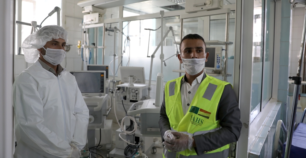 A nurse and a trainer are pictured during a training for operating ventilators for the intensive care ward of a hospital in preparation for any possible spread
