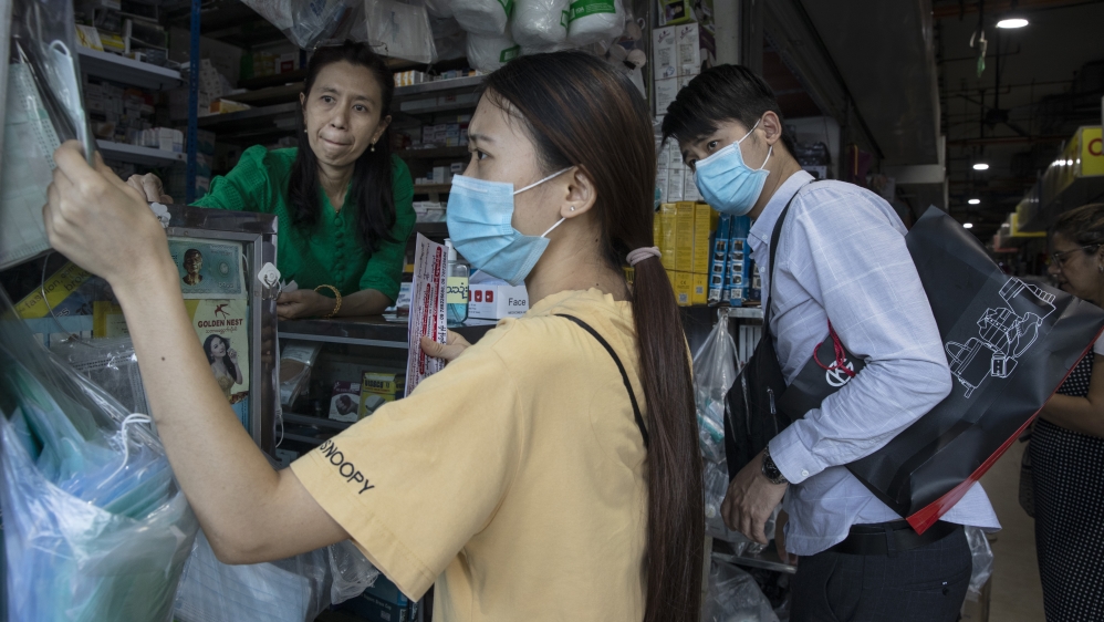 Burmese people shop for masks in a shop on March 03, 2020 in Yangon, Myanmar.