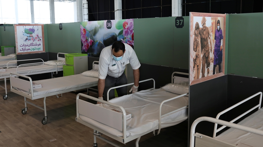 A medical aid worker sets up and installs a bed at a shopping mall, one of Iran’s largest, which has been turned into a centre to receive patients suffering from the coronavirus disease in Tehran