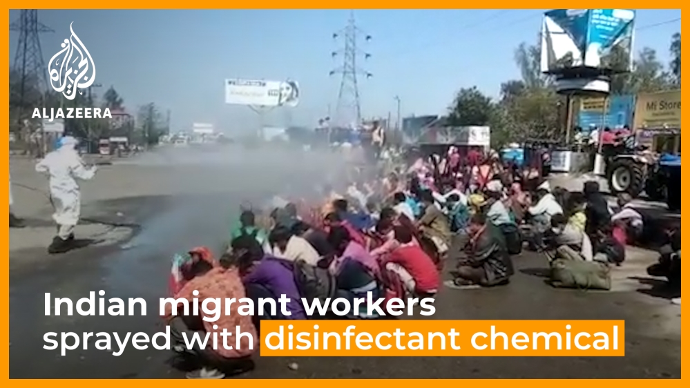 Indian migrant workers sprayed with disinfectant chemical
