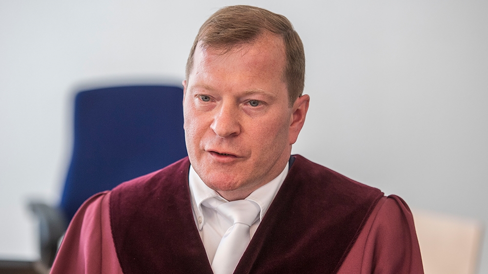 Senior public prosecutor Jasper Klinge answers journalists’ questions outside the courtroom during a break in the trial against the two Syrian defendants accused of state-sponsored torture in Syria, on April 23, 2020, in Koblenz, western Germany
