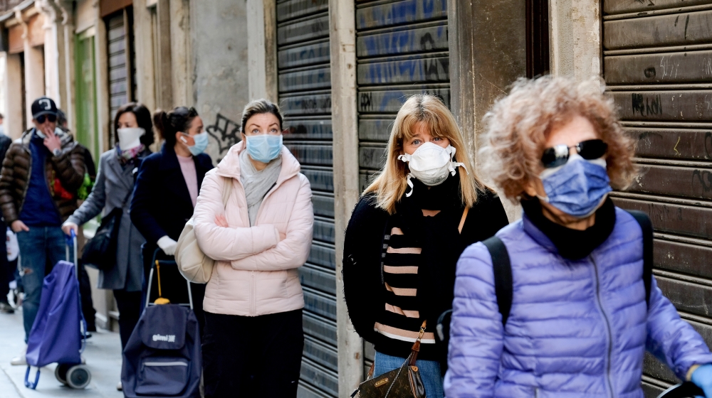 Customers queue at the Rialto fish market, as new restrictions for open-air markets are implemented by the Veneto region to prevent the spread of the coronavirus disease (COVID-19), in Venice, Italy,
