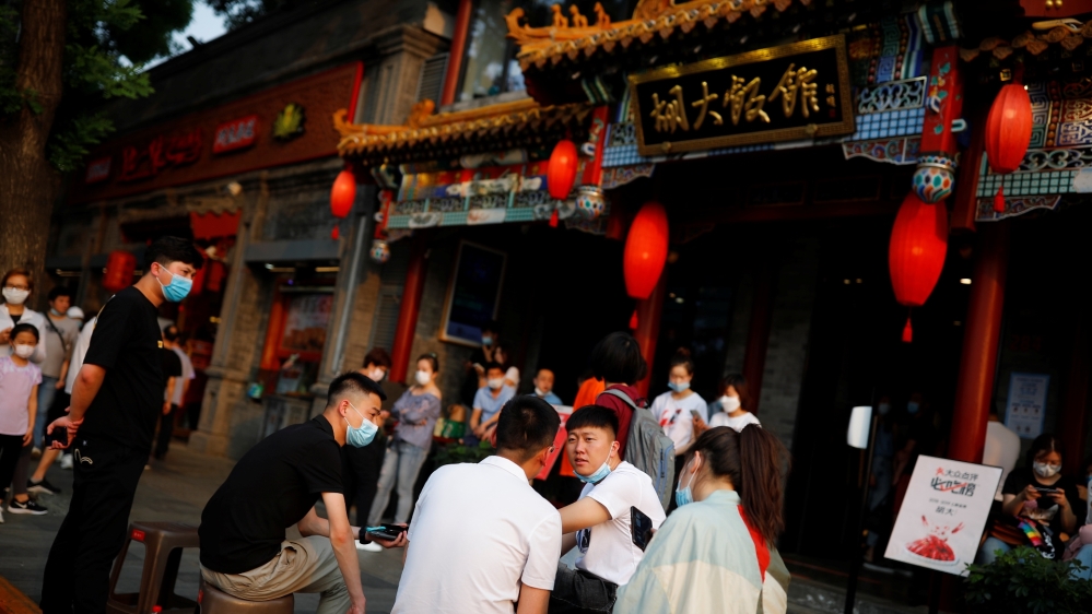People wait to be seated outside a popular restaurant following the coronavirus outbreak in Beijing, China, on May 29, 2020