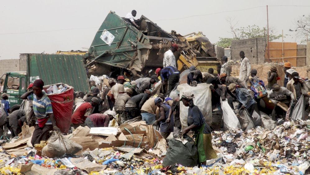 Scavengers work picking up trash for recycling at the Olusosun dump site in Nigeria''s commercial capital Lagos