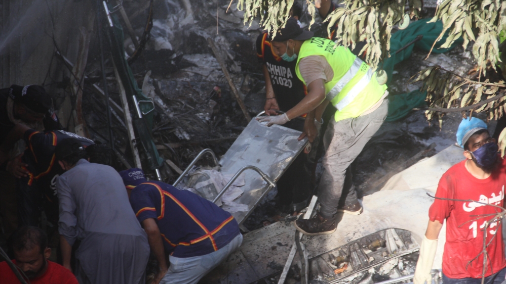Wreckage of the PIA passenger plane crash can be seen in a residential area in Karachi