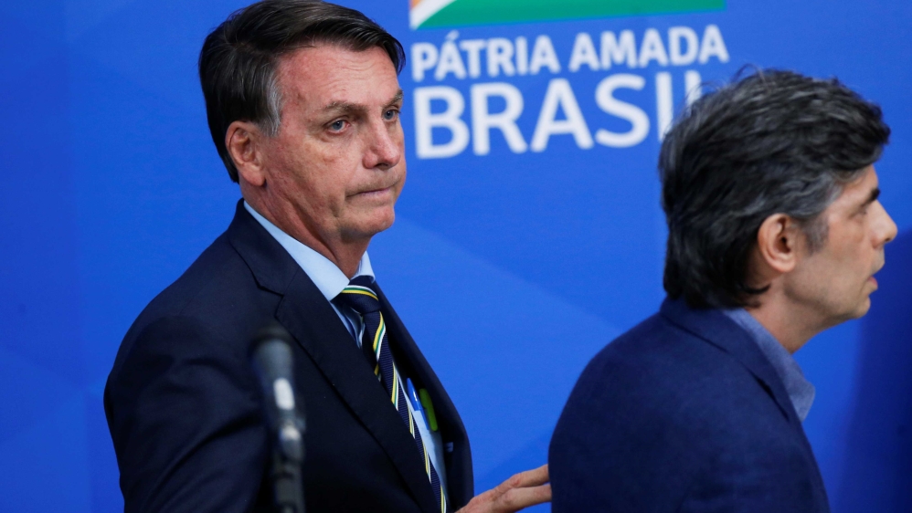 Brazil’s President Jair Bolsonaro walking after making a statement announcing the new Minister of Health, Nelson Teich, in Brasilia, Brazil