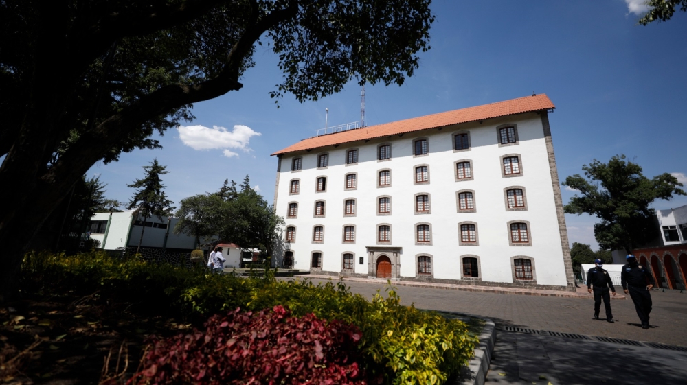 Police walk outside the former presidential residence of Los Pinos in Mexico City