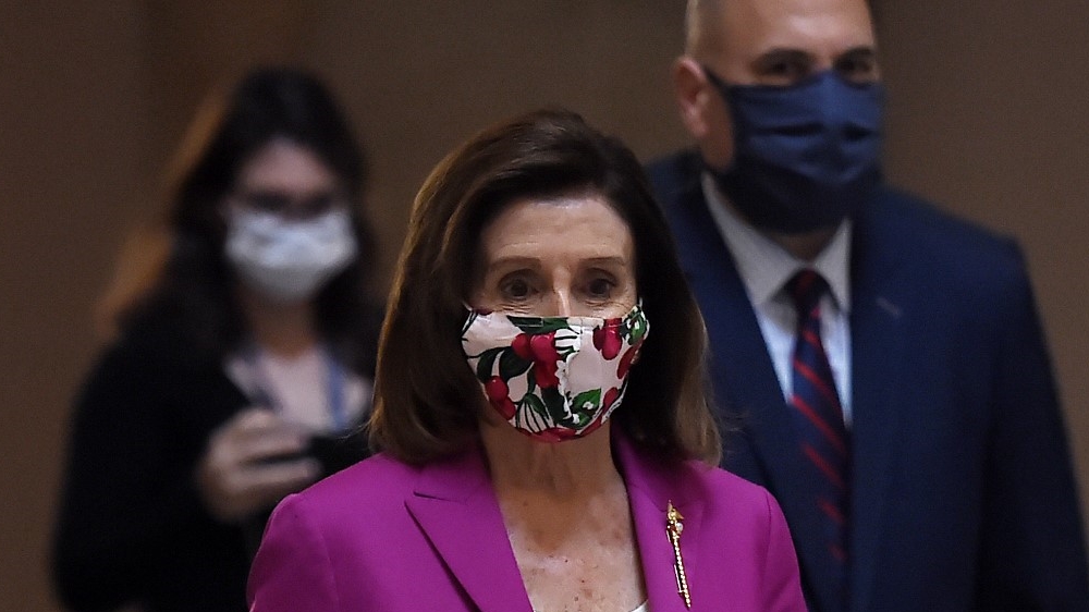 House Speaker Nancy Pelosi walks past the Statuary Hall at the US Capitol on May 15, 2020, in Washington, DC, the United States