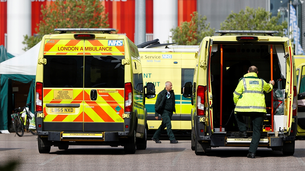 A general view of ambulances and staff outside the NHS Nightingale Hospital at the Excel Centre, following the outbreak of the coronavirus disease (COVID-19), London, Britain, May 5, 2020. REUTERS/Joh