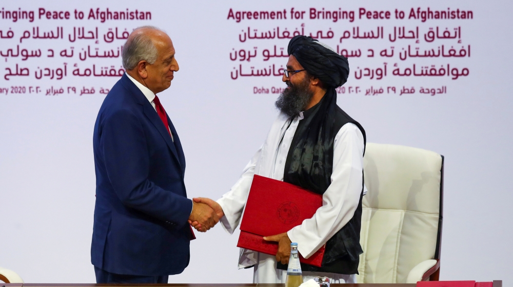 Taliban leader Mullah Abdul Ghani Baradar and Zalmay Khalilzad, U.S. envoy Afghanistan
