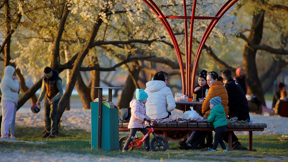 People enjoy the good weather by the lake, as the spread of the coronavirus disease (COVID-19) continues, on the outskirts of Minsk, Belarus, on May 1, 2020