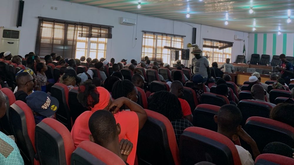 Members of the public sit waiting for a court proceeding to begin at the Federal High Court Ikoyi, Lagos