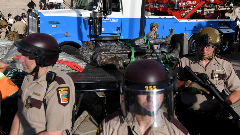 Demonstrators pulled down the statue of Christopher Columbus from the Minnesota State Capitol grounds
