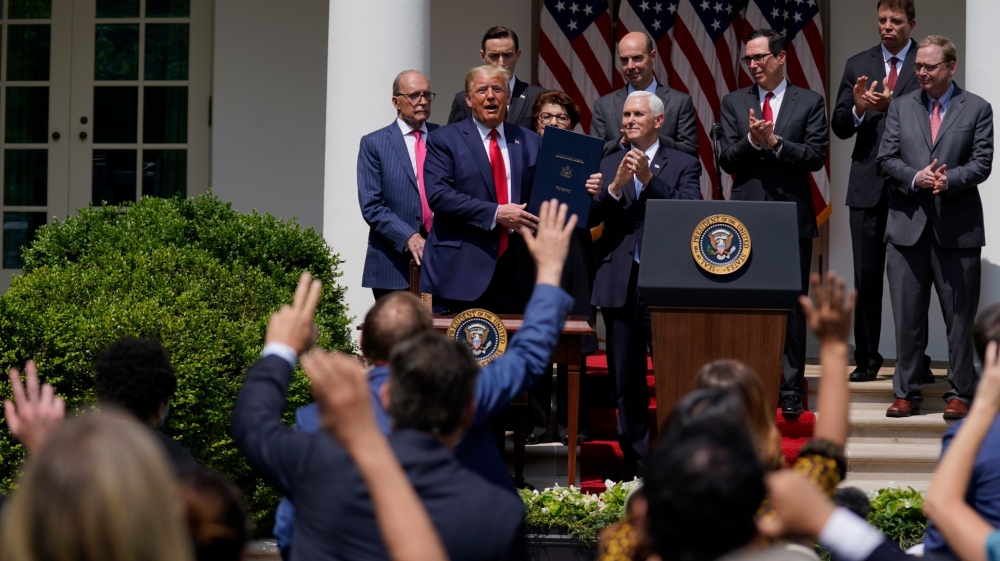 Reporters have condemned the White House’s abandoning of social distancing for reporters