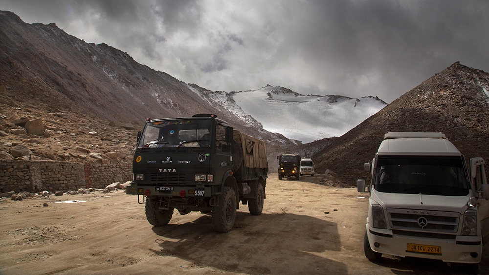 In this Sept. 14, 2018, photo, an Indian Army truck crosses Chang la pass near Pangong Lake in Ladakh region, India. Indian and Chinese soldiers are in a bitter standoff in the remote and picturesque
