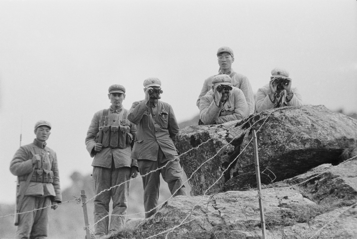 Chinese soldiers guard the border on the Nathu La mountain pass connecting India and China''s Tibet Autonomous Region during the Chola incident (or Sino-Indian skirmish), Himalayas, 3rd October 1967. (