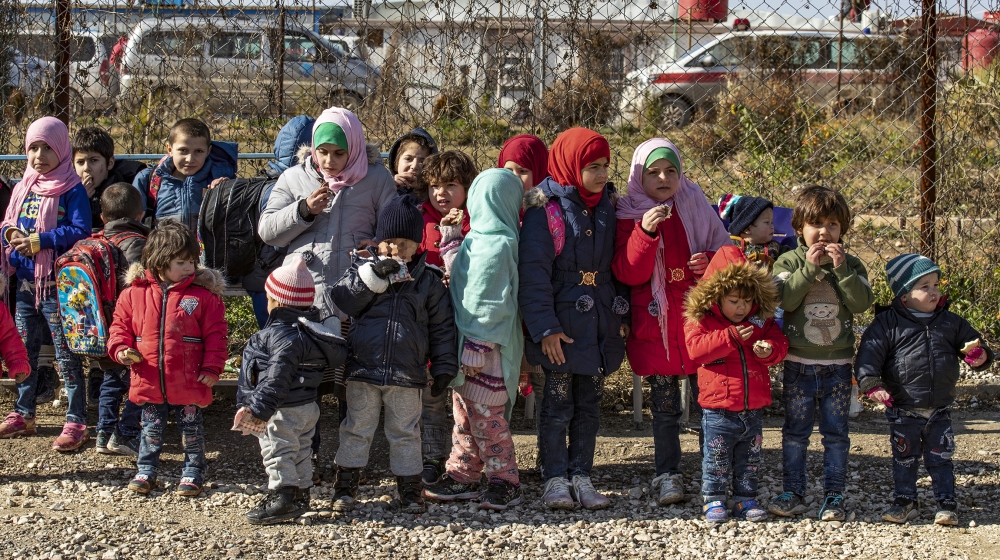 Orphans from various nationalities gather at the Kurdish-run al-Hol camp, home to thousands of relatives of ISIL fighters, in the al-Hasakah governorate in northeastern Syria