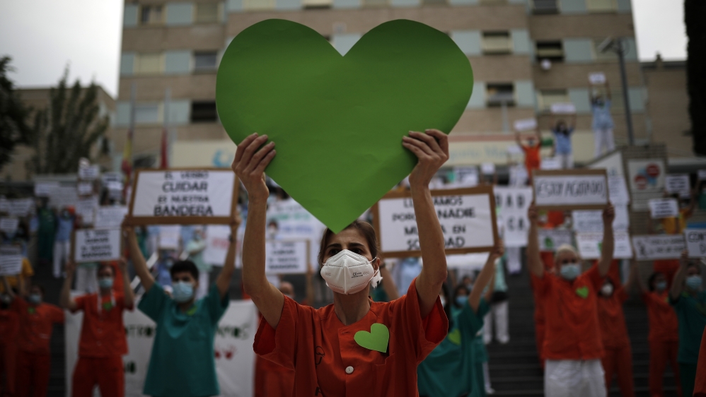 Healthcare workers demanding better working conditions and strengthening of public hospitals due to the coronavirus (COVID-19) pandemic protest outside the Gregorio Maranon Hospital in Madrid, Spain