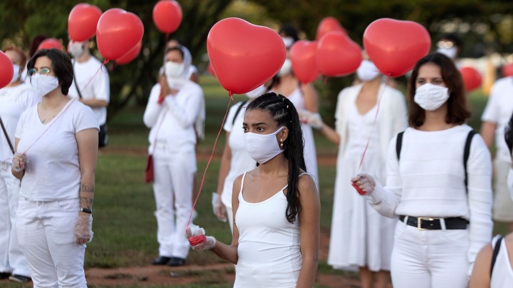 A group of artists pay tribute to the victims of the coronavirus in Brasilia on June 1