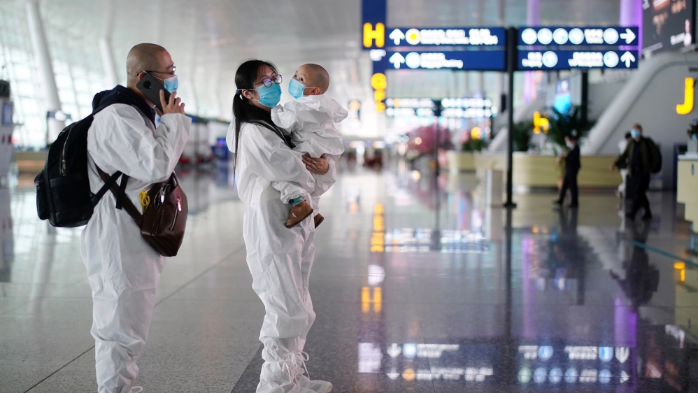 Travellers in protective suits are seen at Wuhan Tianhe International Airport after the lockdown was lifted in Wuhan, the capital of Hubei province and China’s epicentre of the coronavirus disease (COVID-19) outbreak