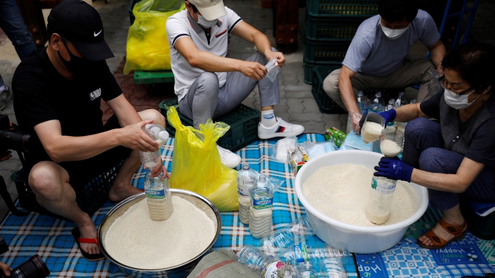 North Korean defector group prepares plastic bottles filled with rice and masks to be sent towards North Korea