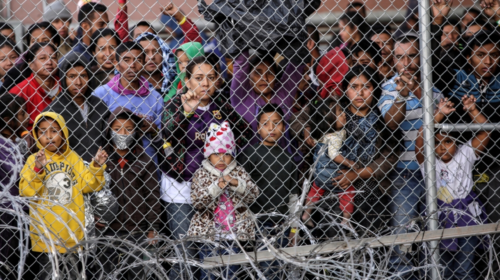 Central American migrants are seen inside an enclosure where they are being held by U.S. Customs and Border Protection (CBP), after crossing the border between Mexico and the United States illegaly an