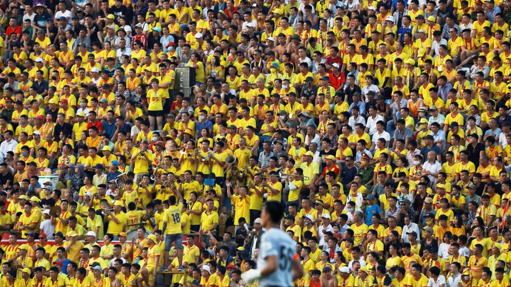 Football fans attend a match between Viettel and Duoc Nam Ha Nam Dinh of the V.League, the national football league, after the government eased a nationwide lockdown following the coronavirus outbreak in Nam Dinh province, Vietnam