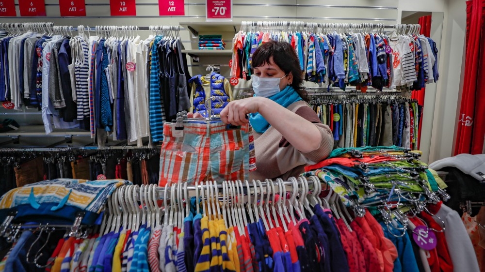 A shop assistant prepares a children’s clothing store for opening in Moscow after Mayor Sergei Sobyanin decided to relax coronavirus restrictions from June 1