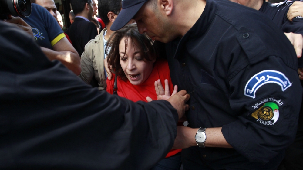Police detain Bouraoui leader of "Barakat" movement during demonstration against election and Algerian President Bouteflika''s decision to run for fourth term, in Algiers